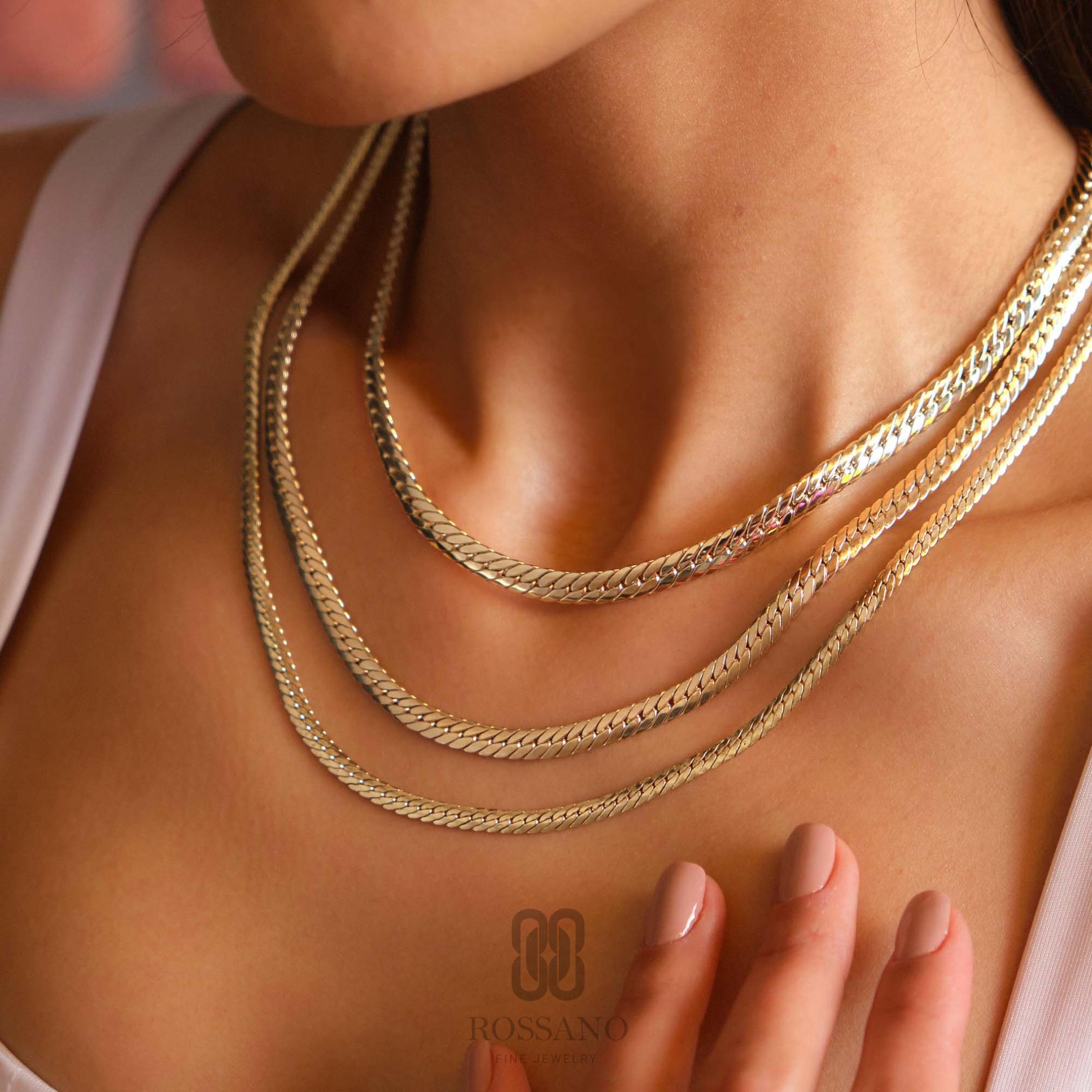 A bold 14K gold Cuban link curb chain necklace